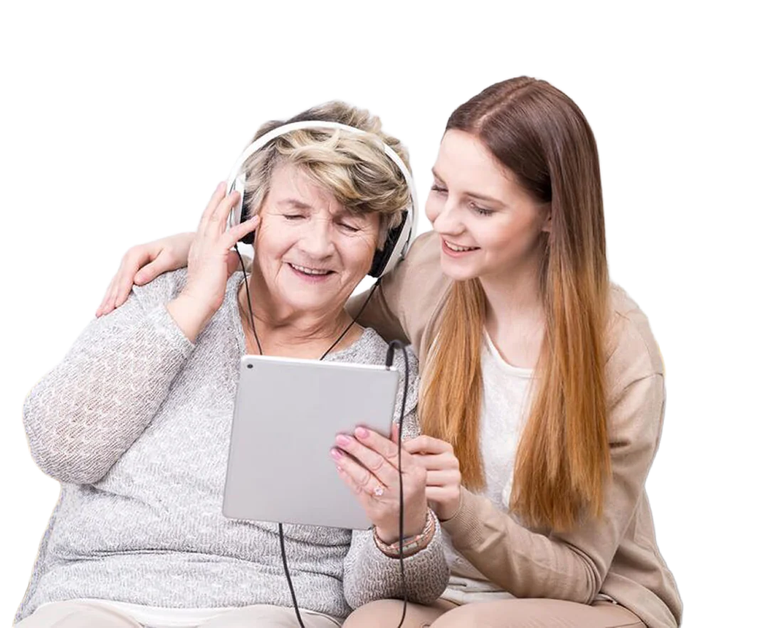 Caregiver sharing a happy moment with an older woman